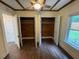 Bedroom with two open closets and ceiling fan at 906 Camden Ave, Durham, NC 27701