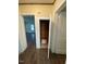 Hallway with a small closet, wood floors, and doors leading to other rooms at 906 Camden Ave, Durham, NC 27701