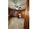 Kitchen featuring wood paneling, tile floors, and a range at 906 Camden Ave, Durham, NC 27701