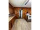Kitchen showcases wood walls, tile floors, countertops, and modern appliances at 906 Camden Ave, Durham, NC 27701