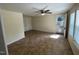 Living room with ceiling fan, neutral walls, and natural light at 906 Camden Ave, Durham, NC 27701