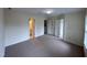 Large bedroom with neutral carpet, multiple doors, and view of the bathroom at 922 Edgewater Cir, Chapel Hill, NC 27516