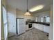 Bright kitchen with white cabinetry, modern appliances, and a view to the living room at 922 Edgewater Cir, Chapel Hill, NC 27516
