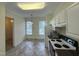 Eat-in kitchen with essential appliances, generous lighting, and convenient access to the dining area at 922 Edgewater Cir, Chapel Hill, NC 27516
