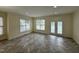 Bright living room with plenty of light from the windows and doors, and recessed lighting at 922 Edgewater Cir, Chapel Hill, NC 27516