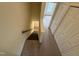 Carpeted staircase looking down; has many storage closets at 922 Edgewater Cir, Chapel Hill, NC 27516