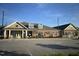 Brick building with peaked roofs and landscaping, situated near ample parking at 937 Baldwin Ridge Rd, Apex, NC 27523