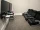 Resident game room with media center and individual gaming chairs for an immersive experience at 937 Baldwin Ridge Rd, Apex, NC 27523