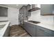 Updated kitchen with stainless steel appliances, gray cabinetry, and a gas cooktop at 937 Baldwin Ridge Rd, Apex, NC 27523