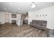 Open-concept living area flowing into a modern kitchen with gray cabinetry at 937 Baldwin Ridge Rd, Apex, NC 27523