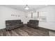 Comfortable living room with hardwood floors, two sofas, and natural lighting at 937 Baldwin Ridge Rd, Apex, NC 27523