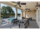 Covered outdoor lounge overlooking a swimming pool and seating, perfect for relaxation and entertaining at 937 Baldwin Ridge Rd, Apex, NC 27523