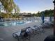 Resort-style pool area with lounge chairs and covered gazebos for relaxing and entertaining at 937 Baldwin Ridge Rd, Apex, NC 27523