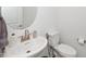 Cozy powder room with a modern vessel sink and brushed nickel faucet at 937 Baldwin Ridge Rd, Apex, NC 27523