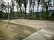 Outdoor sand volleyball court for recreational fun, surrounded by grass and trees at 937 Baldwin Ridge Rd, Apex, NC 27523