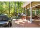 Backyard with a deck, grill, screened-in porch, and shed at 1 Gatesway Ct, Durham, NC 27707