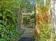 Backyard gate with view of screened-in porch at 1 Gatesway Ct, Durham, NC 27707