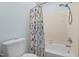 Shower with blue floral curtain and white toilet at 1 Gatesway Ct, Durham, NC 27707