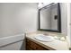 Charming bathroom with a wooden vanity, classic mirror, and neutral color scheme at 1 Gatesway Ct, Durham, NC 27707