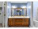 Bathroom features a double sink vanity with wood cabinets and ample counter space at 1 Gatesway Ct, Durham, NC 27707