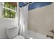 Bathroom with white wainscoting and a tub next to a window at 1 Gatesway Ct, Durham, NC 27707