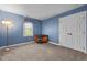 Bedroom with blue walls and a desk next to the window at 1 Gatesway Ct, Durham, NC 27707