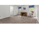 Bright bedroom featuring neutral walls and carpet, a wooden desk and rocking chair at 1 Gatesway Ct, Durham, NC 27707
