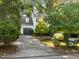 Traditional home with a well-manicured lawn, attached garage, and a paved driveway at 1 Gatesway Ct, Durham, NC 27707