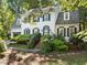 Traditional two-story home with brick stairs leading to the front door and a driveway with a basketball hoop at 1 Gatesway Ct, Durham, NC 27707