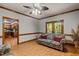 Inviting living room featuring natural light, wood trim, and a comfortable floral sofa at 1 Gatesway Ct, Durham, NC 27707