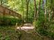 Winding pathway through lush greenery offers a serene and peaceful escape into nature at 1 Gatesway Ct, Durham, NC 27707