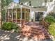 Enjoy outdoor living on the screened porch, with easy access to the deck and beautifully landscaped yard at 1 Gatesway Ct, Durham, NC 27707
