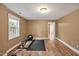 Finished basement featuring a workout space with a bench, exercise ball, and wood floors at 100 Highfield Ave, Cary, NC 27519