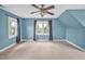 Spacious bedroom with a ceiling fan and a large window with natural light at 100 Highfield Ave, Cary, NC 27519