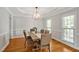 Elegant dining room with hardwood floors, chandelier, and plenty of natural light at 100 Highfield Ave, Cary, NC 27519
