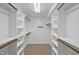Spacious walk-in closet with multiple shelves and wooden support beams at 100 Highfield Ave, Cary, NC 27519