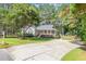 Inviting single-story home with a well-maintained lawn, mature trees and long driveway at 101 Abram Way, Clayton, NC 27520