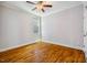 Neutral bedroom with hardwood floors, white walls, and one double hung window for natural light at 104 Treywood Ln, Chapel Hill, NC 27516