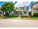 Charming blue two-story home featuring a cozy front porch and beautifully landscaped yard at 104 Treywood Ln, Chapel Hill, NC 27516