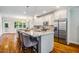 Gourmet kitchen with stainless steel appliances, granite countertops, and an island with seating at 104 Treywood Ln, Chapel Hill, NC 27516