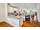 Updated kitchen flows into dining and living spaces at 104 Treywood Ln, Chapel Hill, NC 27516