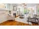 Inviting living room featuring hardwood floors, a fireplace, built-in shelves, and comfortable seating at 104 Treywood Ln, Chapel Hill, NC 27516