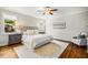Serene main bedroom with a large bed, bedside tables, and a cozy sitting area at 104 Treywood Ln, Chapel Hill, NC 27516