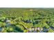 Picturesque overhead shot of neighborhood bordering a verdant golf course at 105 Walter Hagen Dr, Mebane, NC 27302