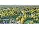Overhead shot displays a neighborhood with tree-lined streets and verdant greenery at 105 Walter Hagen Dr, Mebane, NC 27302