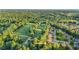 A beautiful neighborhood is captured from above next to a lush green golf course at 105 Walter Hagen Dr, Mebane, NC 27302