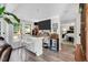 Chic bar area featuring counter seating, a wine fridge, and a view into the primary bedroom at 105 Walter Hagen Dr, Mebane, NC 27302