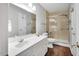 Clean bathroom with vanity, a shower, and tile walls at 105 Walter Hagen Dr, Mebane, NC 27302