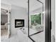 Relaxing bathroom with a fireplace, soaking tub and a glass enclosed shower overlooking the backyard at 105 Walter Hagen Dr, Mebane, NC 27302
