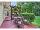 Charming outdoor deck with a seating area, fire pit and privacy landscaping at 105 Walter Hagen Dr, Mebane, NC 27302